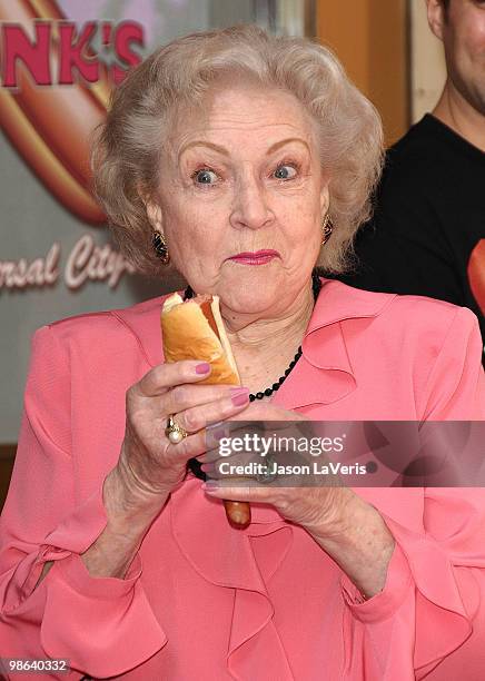 Actress Betty White unveils the "Naked" hot dog at Pink's Hot Dogs at Universal CityWalk on April 19, 2010 in Universal City, California.