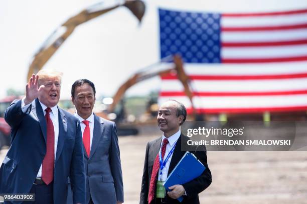 President Donald Trump stands with Foxconn Chairman Terry Gou , and Masayoshi Son, Chief Executive Officer of SoftBank, after a groundbreaking for a...