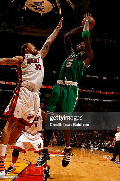 Kevin Garnett of the Boston Celtics shoots against Michael Beasley of the Miami Heat in Game Three of the Eastern Conference Quarterfinals during the...