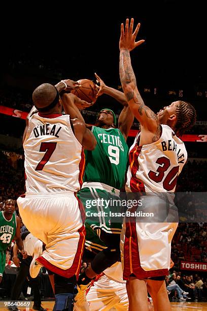 Rajon Rondo of the Boston Celtics shoots against Jermaine O'Neal of the Miami Heat in Game Three of the Eastern Conference Quarterfinals during the...