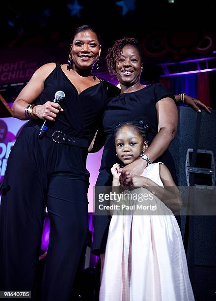 Queen Latifah poses with guests at Fight For Children's School Night 2010 fundraiser at the Ronald Reagan Building on April 23, 2010 in Washington,...