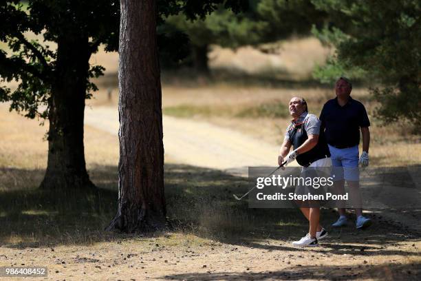 Player makes a shot from the rough during the The Lombard Trophy East Qualifing event at Thetford Golf Club on June 28, 2018 in Thetford, England.