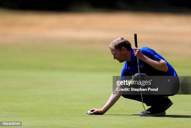 Player lines up a putt on a green during The Lombard Trophy East Qualifing event at Thetford Golf Club on June 28, 2018 in Thetford, England.