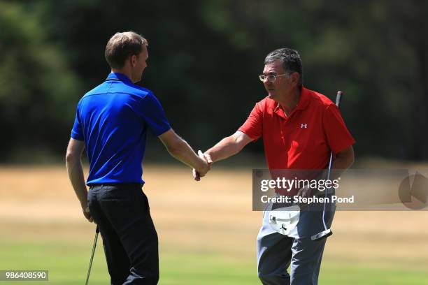 Players shake hands on a green during The Lombard Trophy East Qualifing event at Thetford Golf Club on June 28, 2018 in Thetford, England.