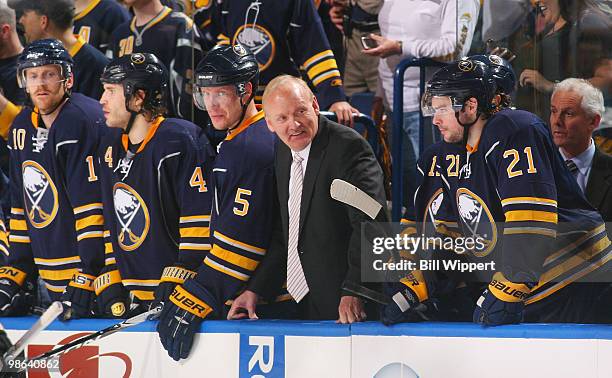 Head coach Lindy Ruff of the Buffalo Sabres smiles while watching the end of an altercation following the conclusion of their 4-1 win over the Boston...