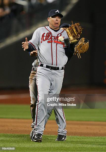 Chipper Jones and Omar Infante of the Atlanta Braves collide and drop a fly ball against the New York Mets on April 23, 2010 at Citi Field in the...