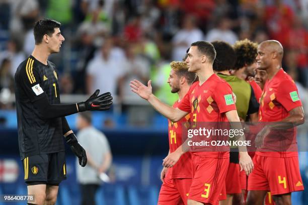 Belgium's goalkeeper Thibaut Courtois celebrates with Belgium's defender Thomas Vermaelen at the end of the Russia 2018 World Cup Group G football...