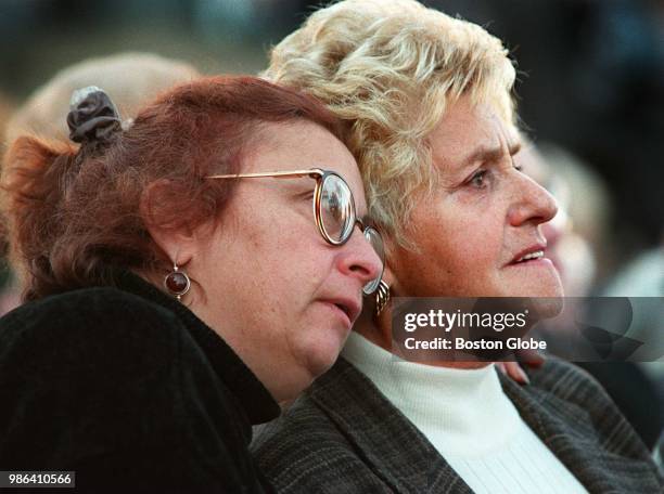 Faye Kass has her arm around her mother, holocaust survivor Frances Cukerman of Brookline, while they listen to the dedication ceremony for the New...