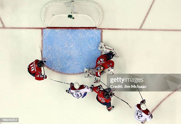 Travis Moen of the Montreal Canadiens scores a first period goal past Semyon Varlamov of the Washington Capitals in Game Five of the Eastern...