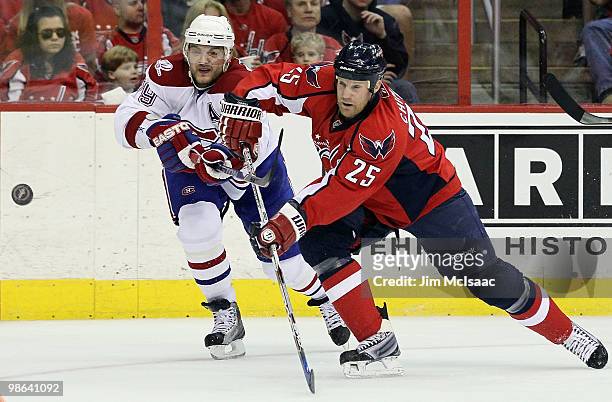 Jason Chimera of the Washington Capitals shoots the puck against Andrei Markov of the Montreal Canadiens in Game Five of the Eastern Conference...