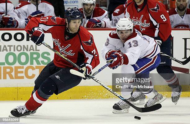Mike Knuble of the Washington Capitals skates against Mike Cammalleri of the Montreal Canadiens in Game Five of the Eastern Conference Quarterfinals...
