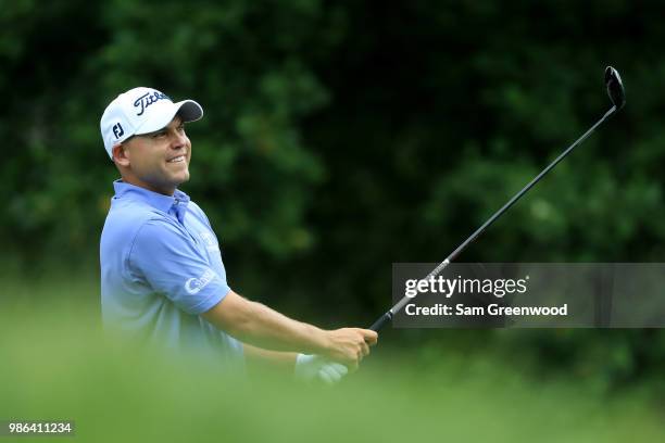 Bill Haas plays a shot on the fourth hole during the first round of the Quicken Loans National at TPC Potomac on June 28, 2018 in Potomac, Maryland.