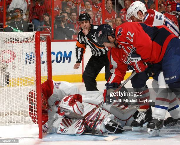 Goalie Jaroslav Halak of the Montreal Canadiens saves a shot by Mike Knuble of the Washington Capitals as Hal Gill of the Canadiens defends in Game...