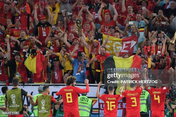 Belgium's players celebrate with fans at the end of the Russia 2018 World Cup Group G football match between England and Belgium at the Kaliningrad...