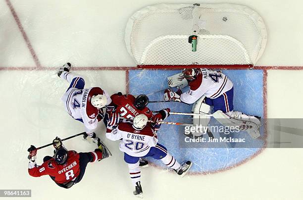 Alex Ovechkin of the Washington Capitals scores a second period goal past Jaroslav Halak of the Montreal Canadiens in Game Five of the Eastern...