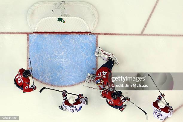 Travis Moen of the Montreal Canadiens scores a first period goal past Semyon Varlamov of the Washington Capitals in Game Five of the Eastern...