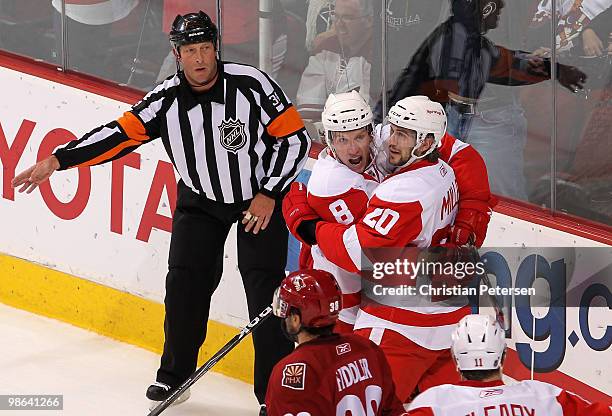 Drew Miller of the Detroit Red Wings celebrates with teammate Justin Abdelkader after Miller scored a first period goal against the Phoenix Coyotes...