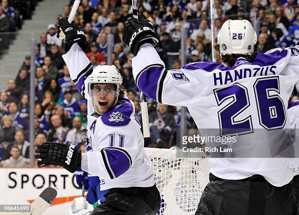 Anze Kopitar of the Los Angeles Kings celebrates after teammate Michal Handzus scored against the Vancouver Canucks during the first period in Game...