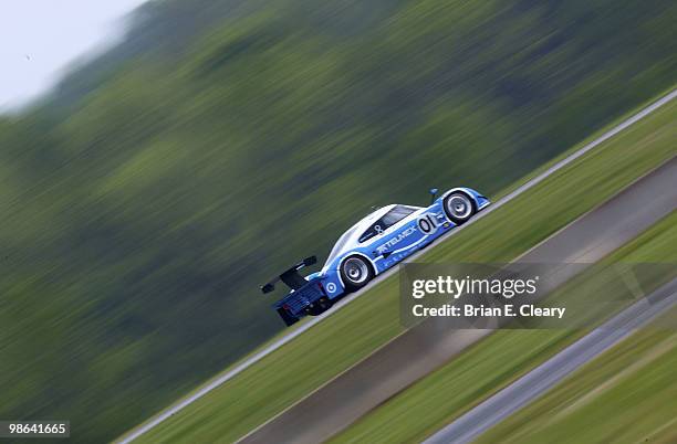 The BMW Riley of Scott Pruett and Memo Rojas races down a straightaway during practice for the Bosch Engineering 250 at Virginia International...