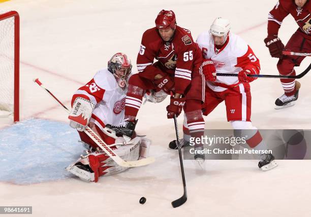 Ed Jovanovski of the Phoenix Coyotes scores a second period goal past goaltender Jimmy Howard of the Detroit Red Wings as Nicklas Lidstrom defends in...