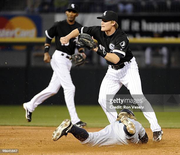 Eric Byrnes of the Seattle Mariners steals second base as Gordon Beckham of the Chicago White Sox waits for the throw on April 23, 2010 at U.S....