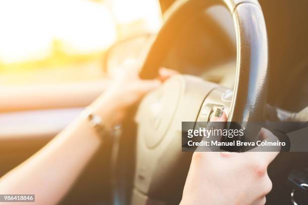 woman driving her car - kilometer stockfoto's en -beelden