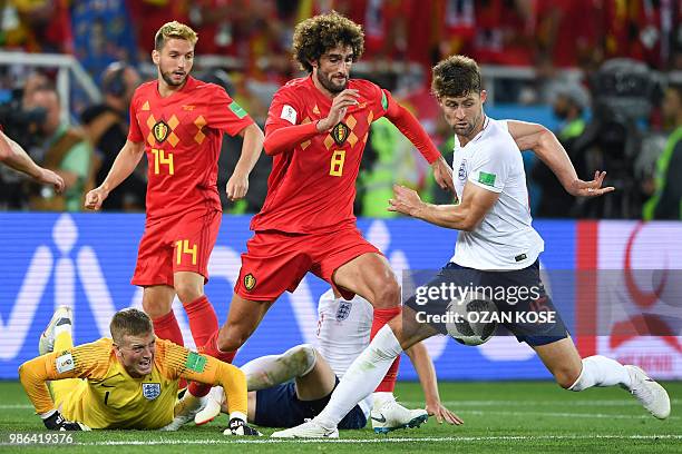 England's defender Gary Cahill vies with Belgium's midfielder Marouane Fellaini during the Russia 2018 World Cup Group G football match between...