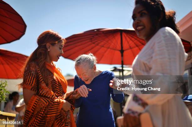From left, Leya Assefa, Helen Malone and Rose Wolde are dancing with Ethiopian music. A dozen of Ethiopian caregivers in traditional garb introduced...