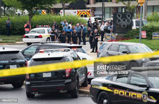 Police respond to a shooting in Annapolis, Maryland, June 28, 2018. - Several people were feared killed Thursday in a shooting at the building that...