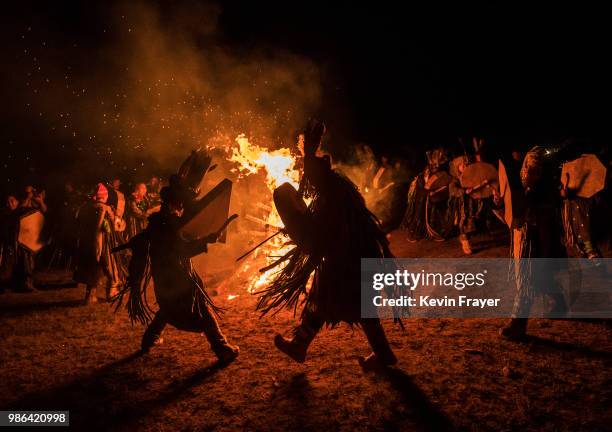 Mongolian Shamans or Buu, beat their drums as they take part in a fire ritual meant to summon spirits to mark the period of the Summer Solstice in...