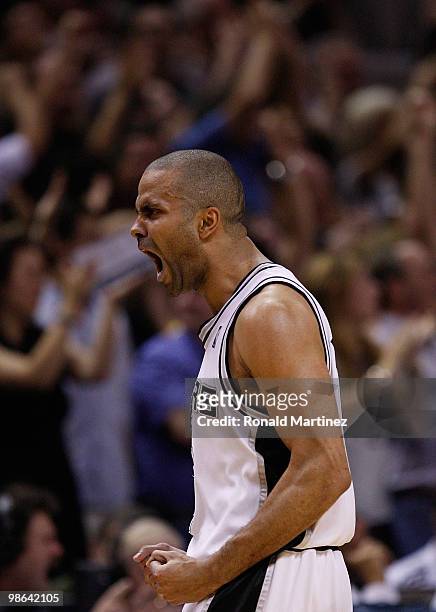 Guard Tony Parker of the San Antonio Spurs reacts after scoring a three point shot against the Dallas Mavericks in Game Three of the Western...