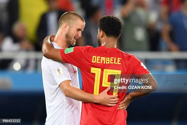 England's midfielder Eric Dier congratulates Belgium's midfielder Moussa Dembele at the end of the Russia 2018 World Cup Group G football match...