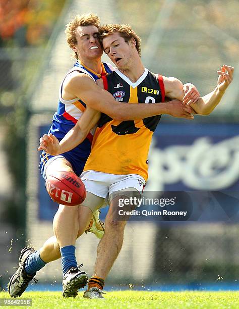 Bradley Tagg of the Stingrays is tackled by Bradley Harvey of the Ranges during the round four TAC Cup match between the Eastern Ranges and Dandenong...