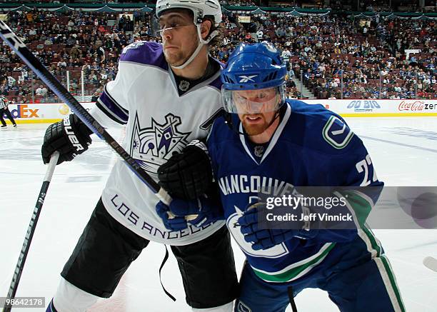 Anze Kopitar of the Los Angeles Kings checks Daniel Sedin of the Vancouver Canucks during the second period in Game Five of the Western Conference...