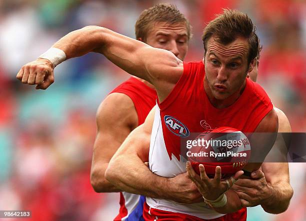 Jude Bolton of the Swans is tackled during the round five AFL match between the Sydney Swans and the West Coast Eagles at the Sydney Cricket Ground...