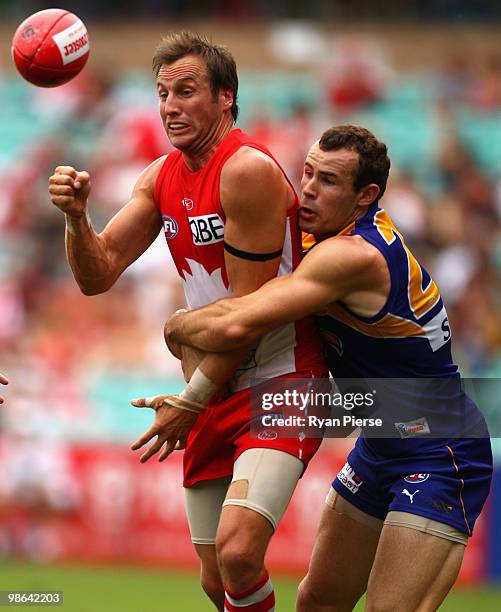 Jude Bolton of the Swans is tackled by Shannon Hurn of the Eagles during the round five AFL match between the Sydney Swans and the West Coast Eagles...