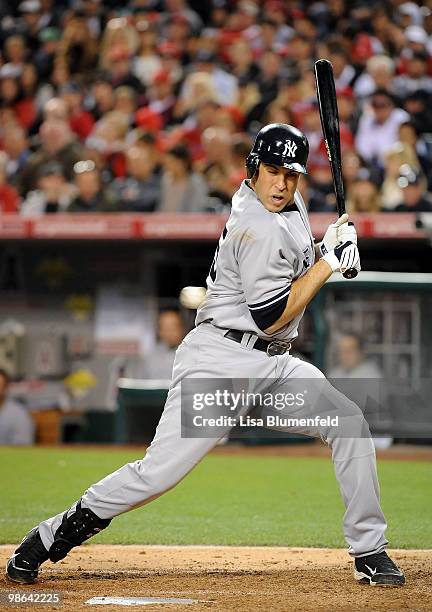 Mark Teixeira of the New York Yankees is hit by a pitch in the third inning against the Los Angeles Angels of Anaheim on April 23, 2010 in Anaheim,...