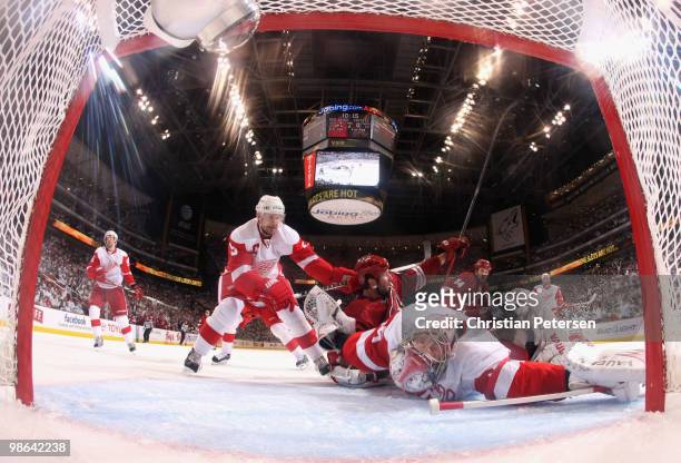 Ed Jovanovski of the Phoenix Coyotes reacts after scoring a second period goal past goaltender Jimmy Howard and Nicklas Lidstrom of the Detroit Red...