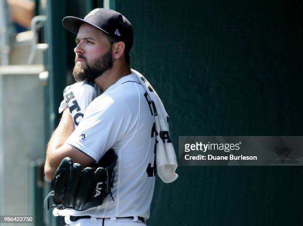Starting pitcher Michael Fulmer of the Detroit Tigers watches from the dugout during the eighth inning of a game against the Oakland Athletics at...