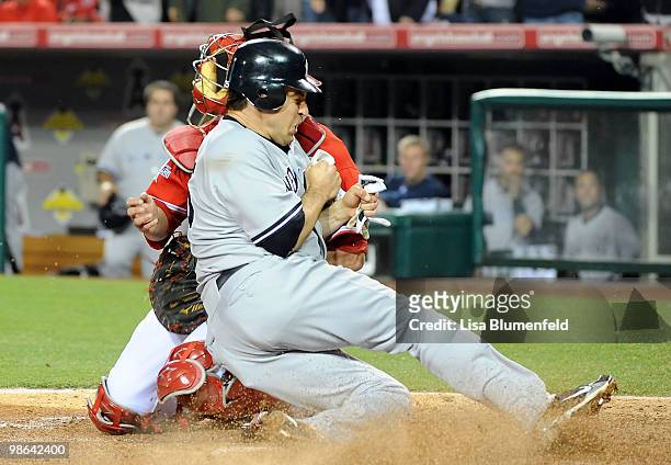 Mark Teixeira of the New York Yankees is safe at homeplate in the third inning against Bobby Wilson of the Los Angeles Angels of Anaheim on April 23,...