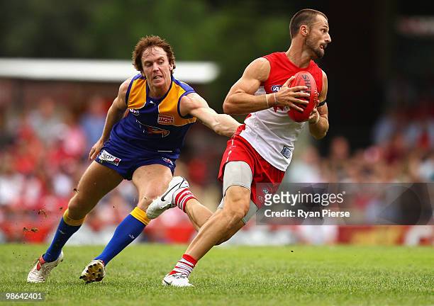 Nick Malceski of the Swans breaks the tackle of Bradd Dalziell of the Eagles during the round five AFL match between the Sydney Swans and the West...