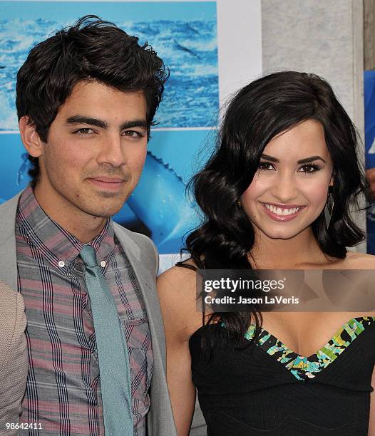 Joe Jonas and Demi Lovato attend the premiere of "Oceans" at the El Capitan Theatre on April 17, 2010 in Hollywood, California.