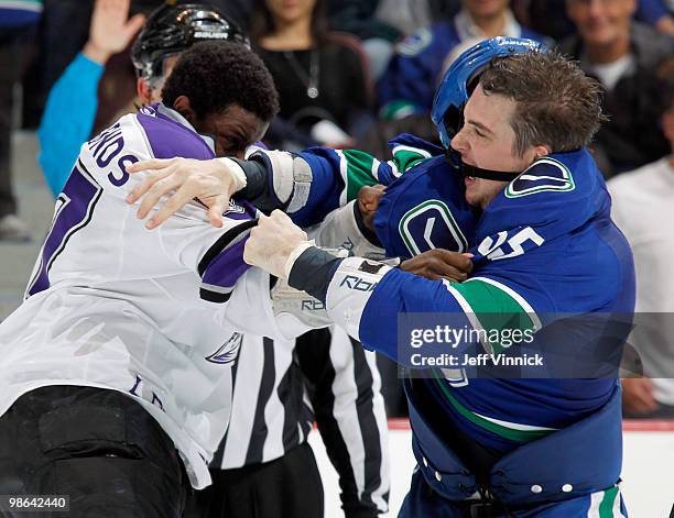 Wayne Simmonds of the Los Angeles Kings and Shane O'Brien of the Vancouver Canucks exchange punches in Game Five of the Western Conference...