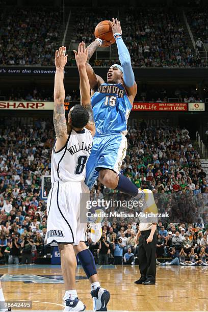 Carmelo Anthony of the Denver Nuggets goes up for the shot over Deron Williams of the Utah Jazz in Game Three of the Western Conference Quarterfinals...