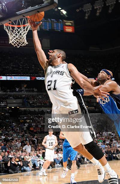 Tim Duncan of the San Antonio Spurs shoots against Erick Dampier of the Dallas Mavericks in Game Three of the Western Conference Quarterfinals during...