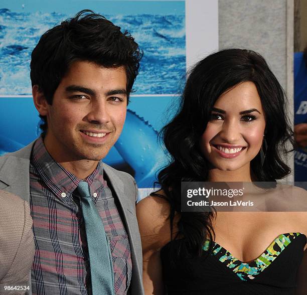 Joe Jonas and Demi Lovato attend the premiere of "Oceans" at the El Capitan Theatre on April 17, 2010 in Hollywood, California.