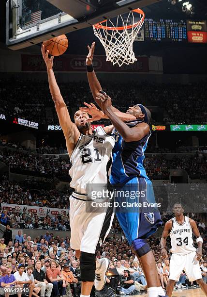 Tim Duncan of the San Antonio Spurs shoots against James Singleton of the Dallas Mavericks in Game Three of the Western Conference Quarterfinals...