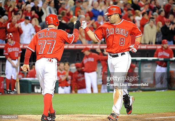 Kendry Morales of the Los Angeles Angels of Anaheim celebrates with teammate Reggie Willits after hitting a two-run homerun in the eighth inning...