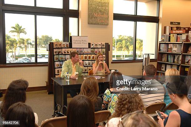 Simon van Kempen and Alex McCord from the cast of "Real Housewives of New York City" sign copies of "Little Kids, Big City" on April 23, 2010 in Boca...