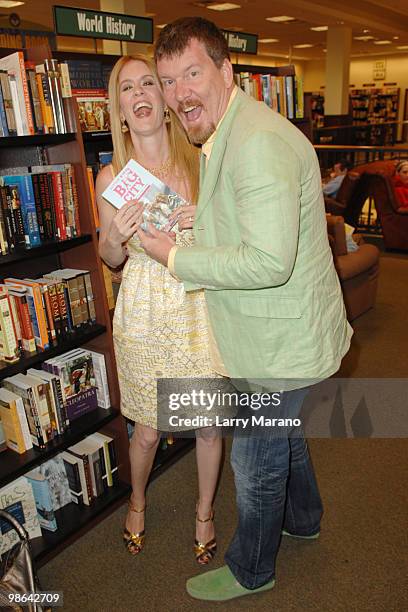 Alex McCord and Simon van Kempen from the cast of "Real Housewives of New York City" sign copies of "Little Kids, Big City" on April 23, 2010 in Boca...